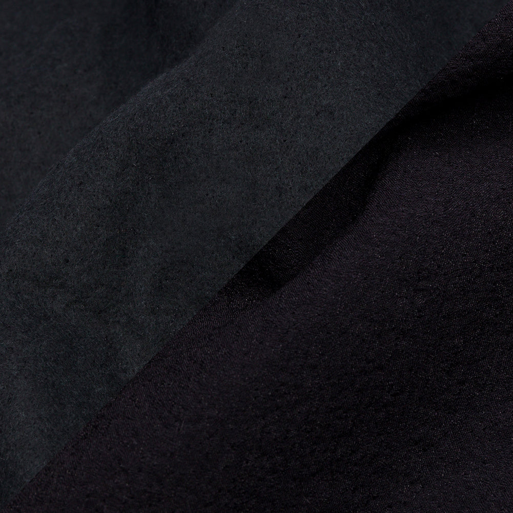 Navy Textured Polyester Woven Bonded to Gray Brushed Cotton Coating - Detail Navy Textured Polyester Woven Bonded to Gray Brushed Cotton Coating - Detail