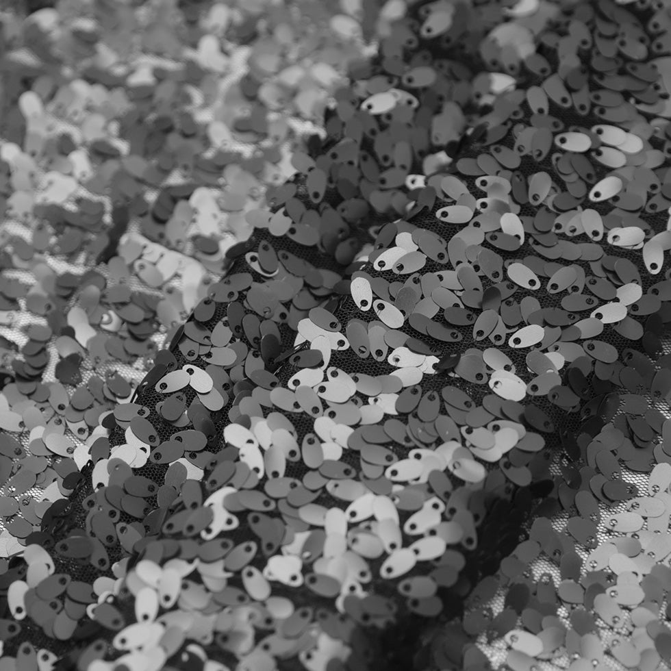 Black Oval Piette Sequins on Polyester Mesh Folded Black Oval Piette Sequins on Polyester Mesh Folded