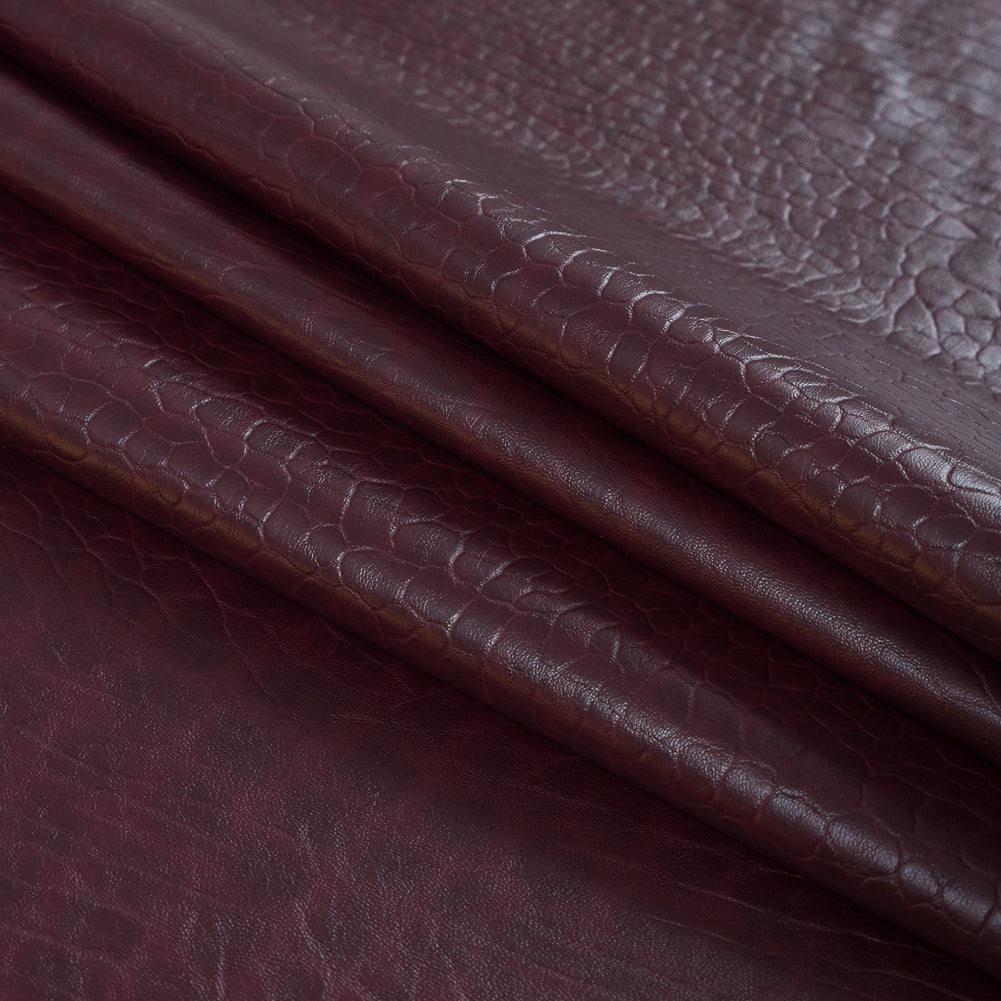 Cordovan Pebble Embossed Stretch Faux Leather with a Black Viscose Backing - Detail Cordovan Pebble Embossed Stretch Faux Leather with a Black Viscose Backing - Detail