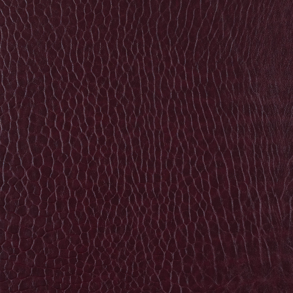 Cordovan Pebble Embossed Stretch Faux Leather with a Black Viscose Backing Cordovan Pebble Embossed Stretch Faux Leather with a Black Viscose Backing