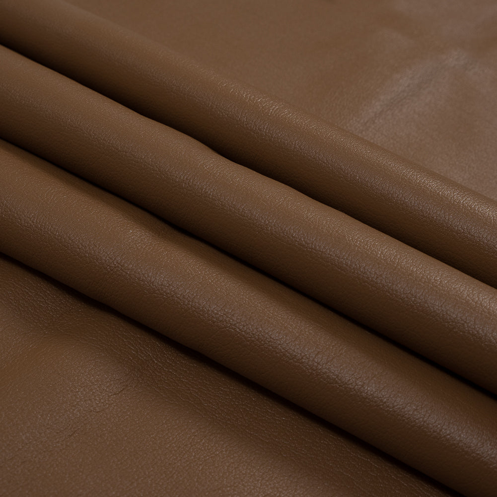 Warm Brown Faux Leather Bonded to a Cream Shearling Folded Warm Brown Faux Leather Bonded to a Cream Shearling Folded