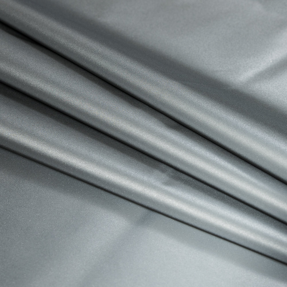 White Cotton-Backed Reflective Fabric Detail White Cotton-Backed Reflective Fabric Detail