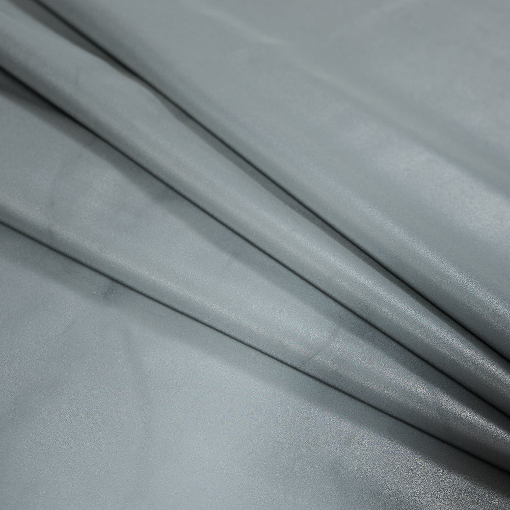 Silver Stretch Knit Reflective Fabric with White Backside Detail Silver Stretch Knit Reflective Fabric with White Backside Detail