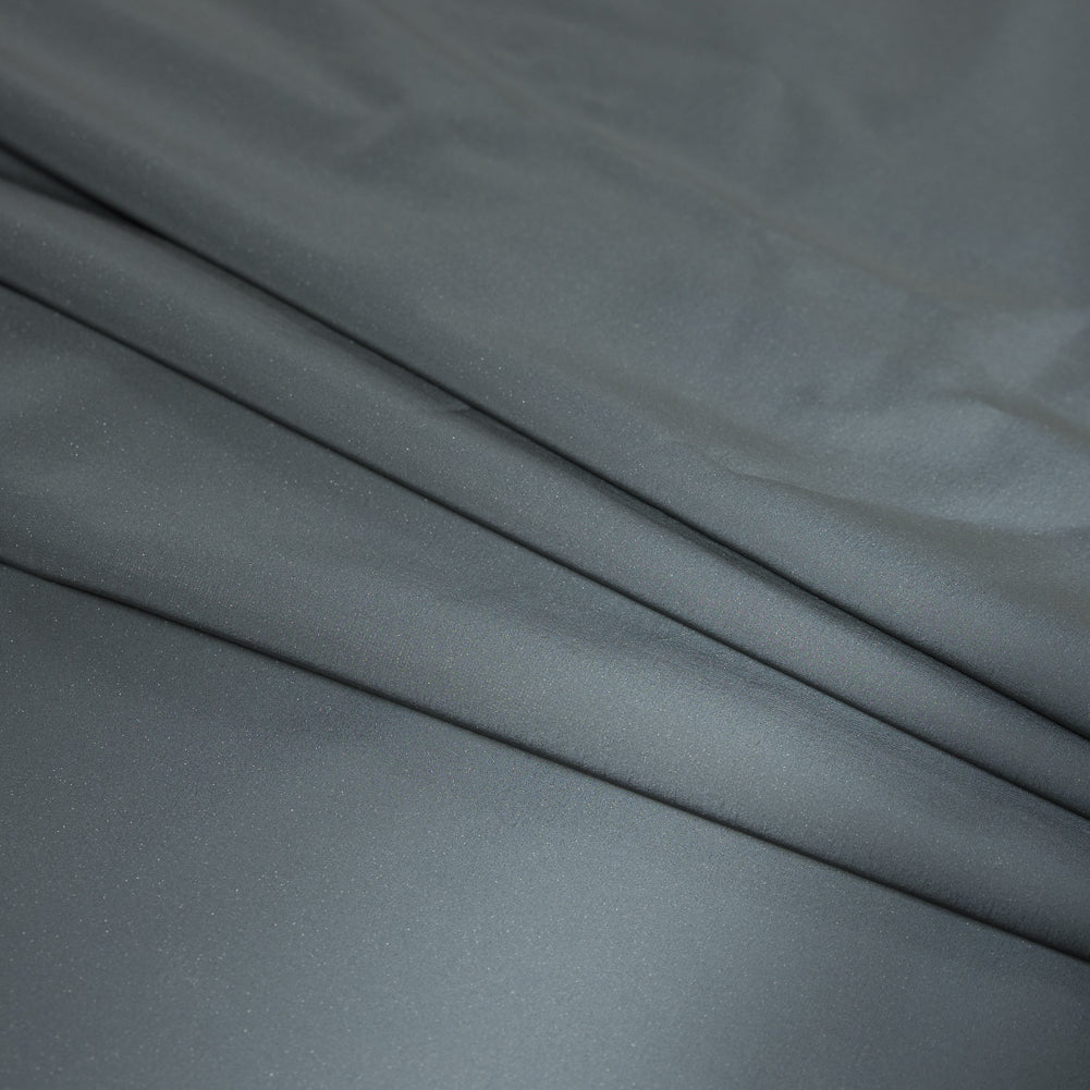 Silver on Black Fleece-Backed Reflective Fabric Detail Silver on Black Fleece-Backed Reflective Fabric Detail