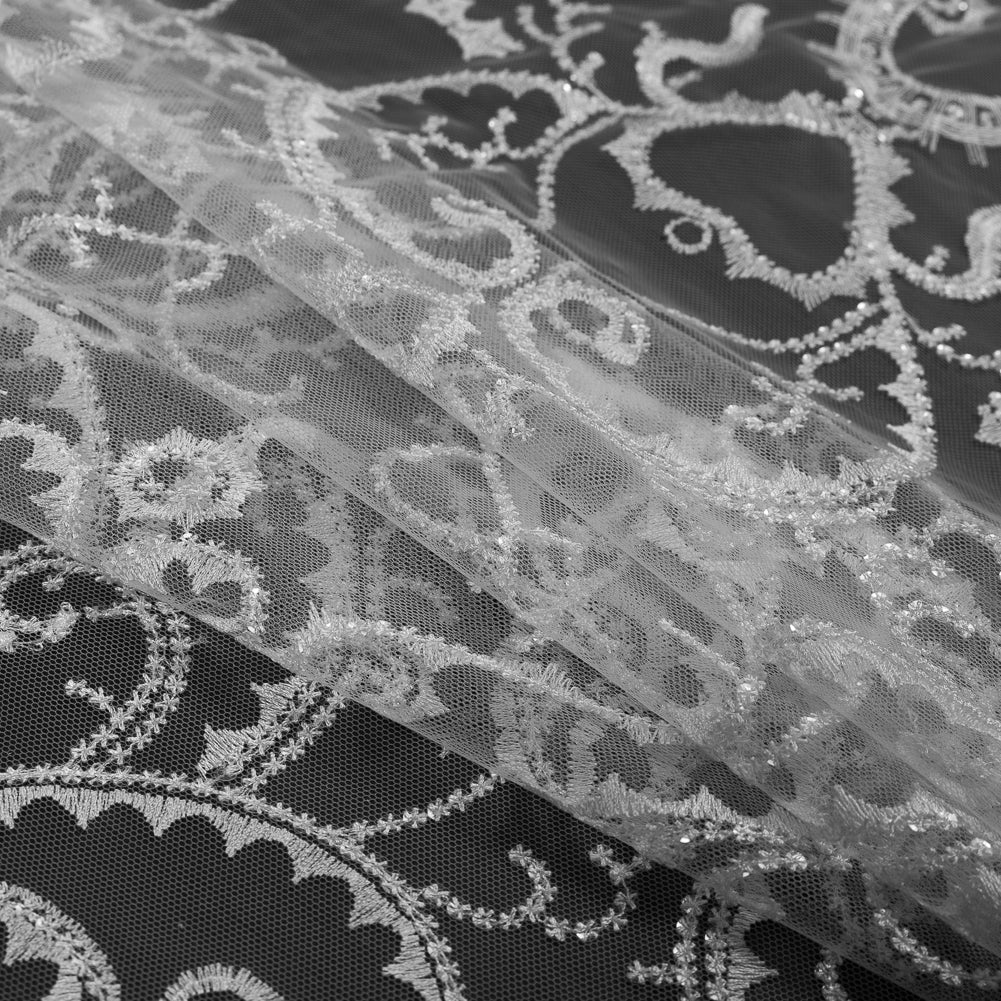 Embroidered Tulle with Sequins - White Fancy Swirls Folded Embroidered Tulle with Sequins - White Fancy Swirls Folded