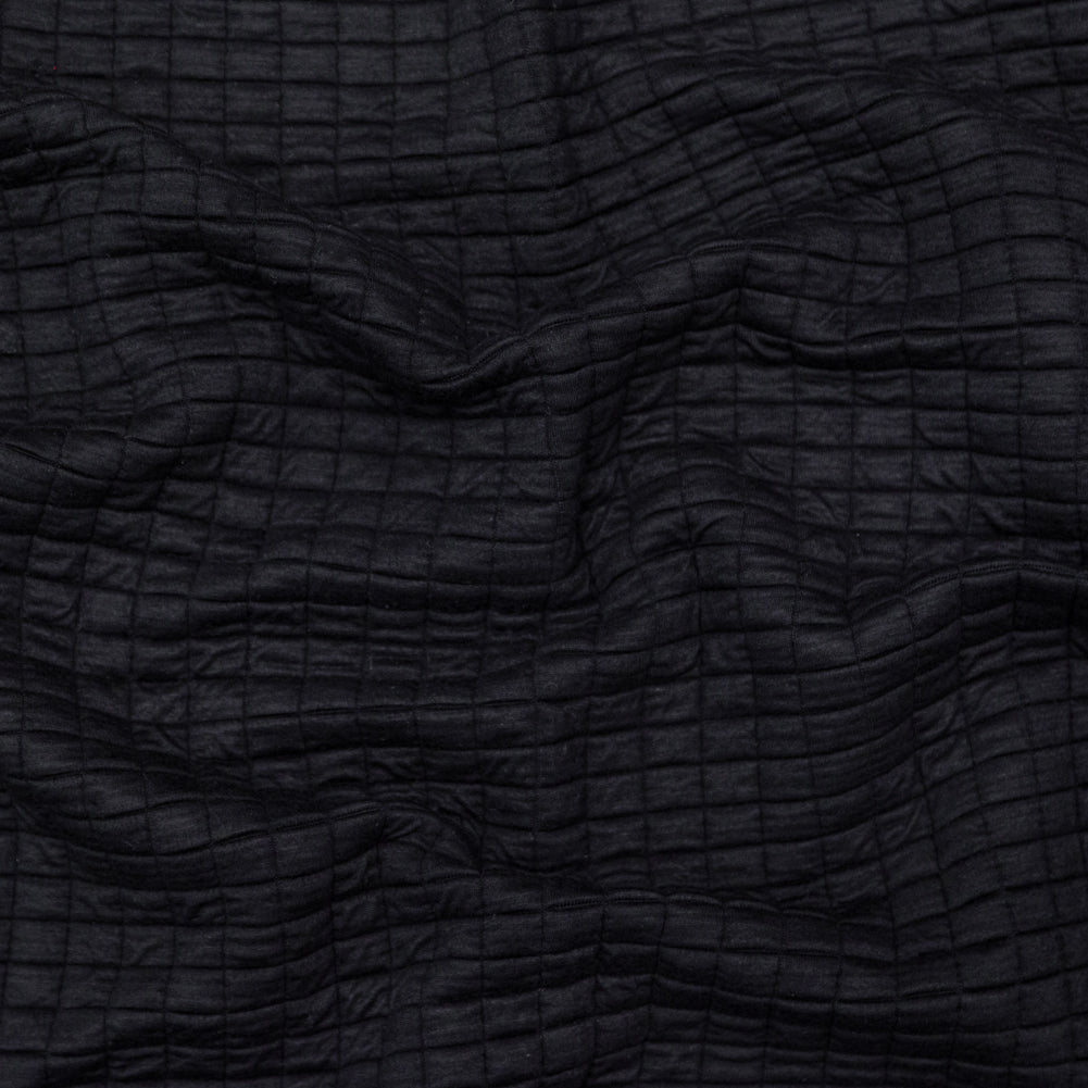 Black Quilted Rayon Knit with Filler and Polyester Knit Backing Black Quilted Rayon Knit with Filler and Polyester Knit Backing
