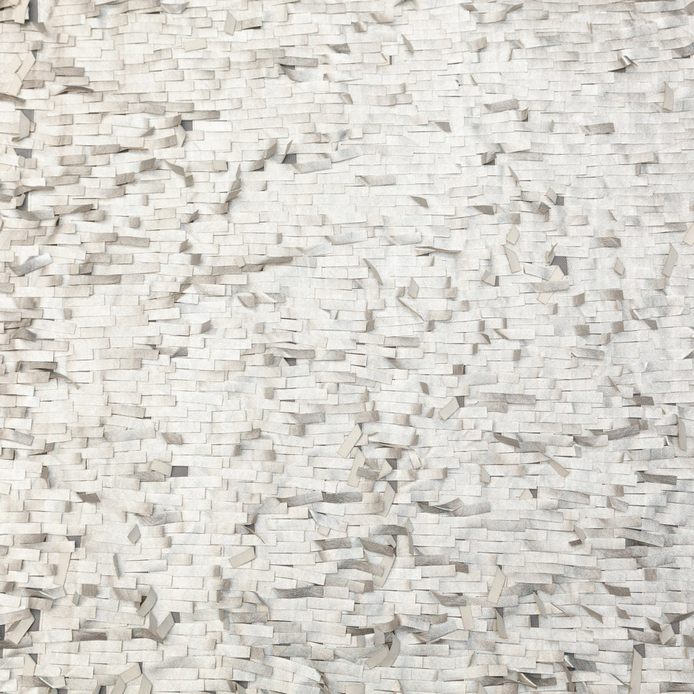 Faux Leather Fringe Fabric on a Mesh Backing - Metallic Silver on White Faux Leather Fringe Fabric on a Mesh Backing - Metallic Silver on White