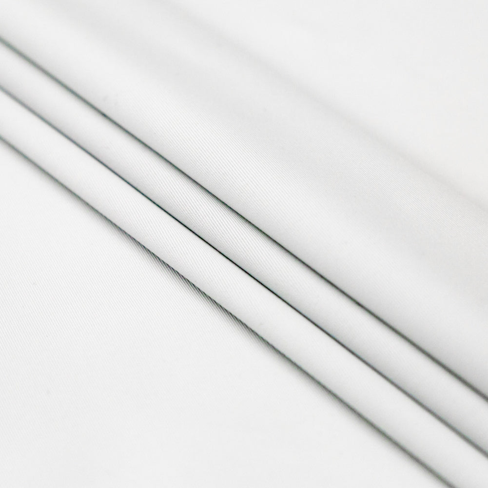 Compression Swimwear Tricot, UV Protective with Aloe Vera Microcapsules - White - Caye Collection Folded