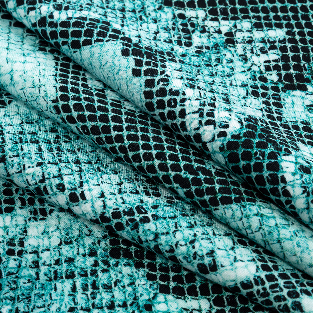 Compression Swimwear Tricot, UV Protective with Aloe Vera Microcapsules - Turquoise Python - Caye Collection Folded Compression Swimwear Tricot, UV Protective with Aloe Vera Microcapsules - Turquoise Python - Caye Collection Folded
