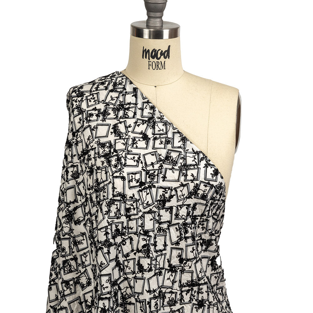 Black and White Flocked Florals on Tossed Squares Printed Viscose Woven Drape Black and White Flocked Florals on Tossed Squares Printed Viscose Woven Drape