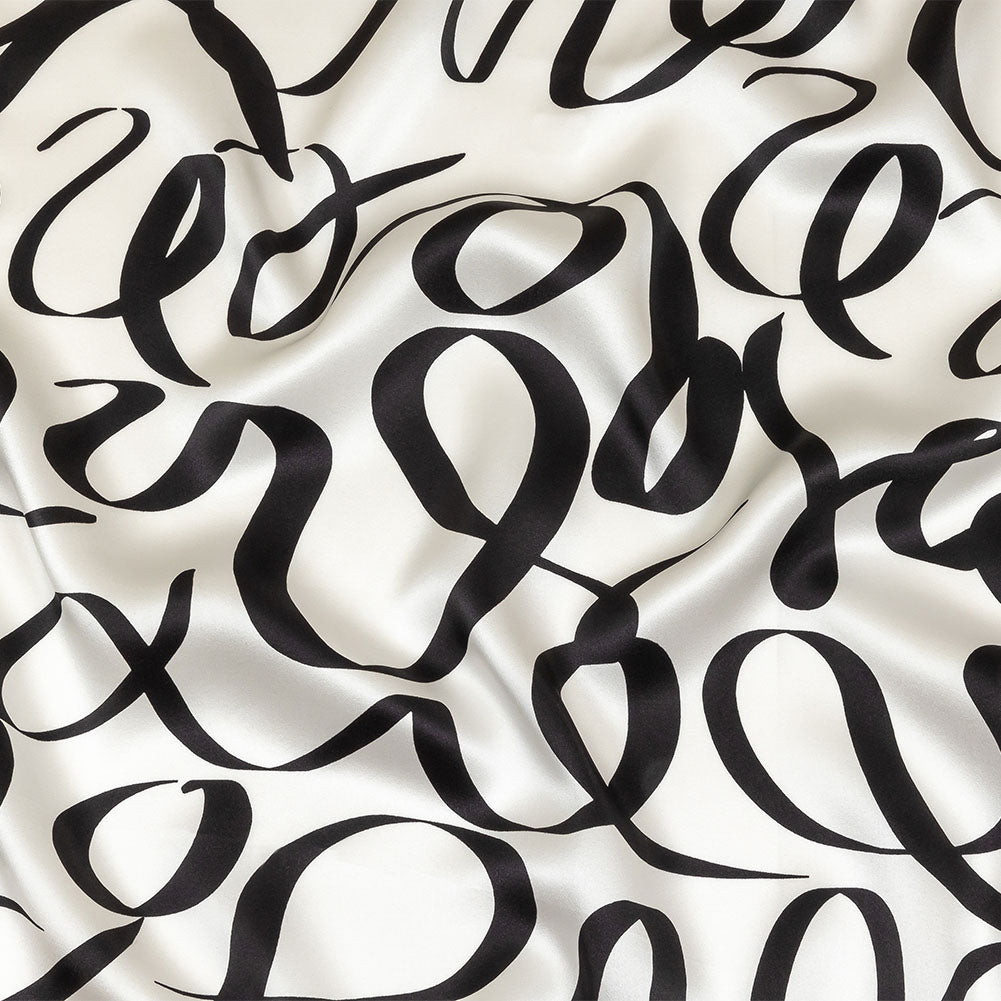 Mood Exclusive Italian Blanc de Blanc and Caviar Calligraphic Squiggles Silk Charmeuse Mood Exclusive Italian Blanc de Blanc and Caviar Calligraphic Squiggles Silk Charmeuse