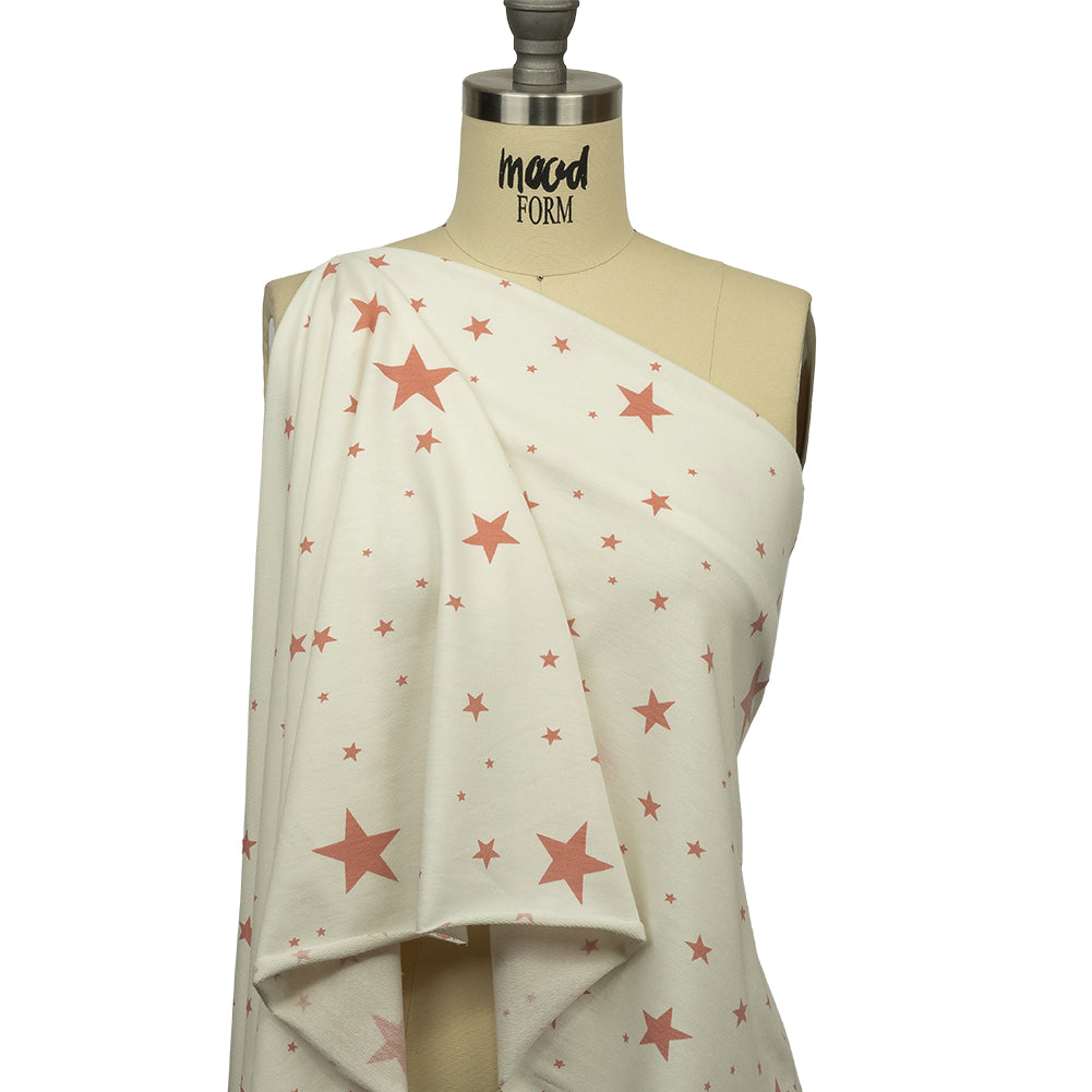 Cloud Dancer and Coral Almond Stars Stretch Polyester and Rayon French Terry Drape Cloud Dancer and Coral Almond Stars Stretch Polyester and Rayon French Terry Drape