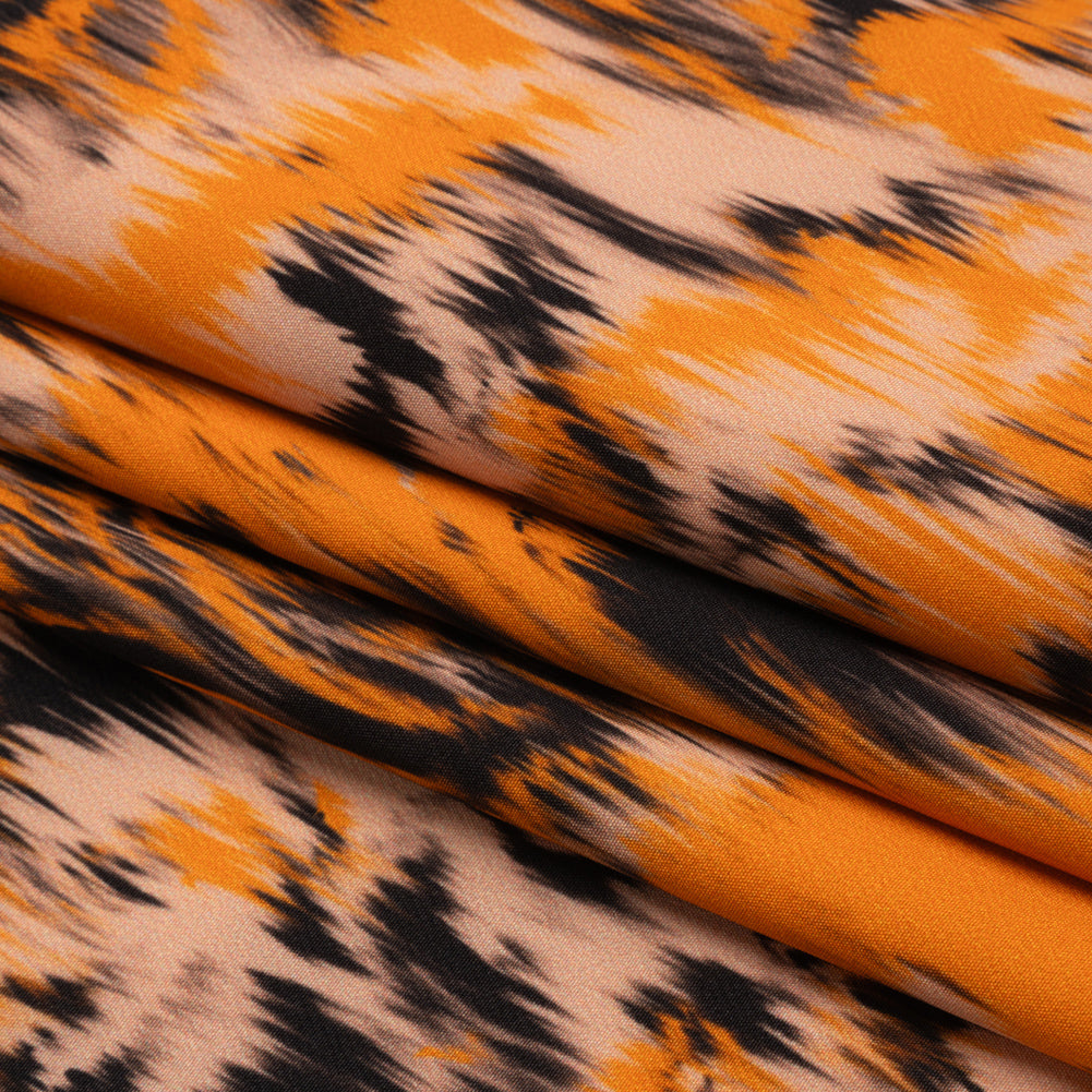 Stretch Polyester Woven Print - Orange and Black Abstract Ikat - Mood Exclusive Shifting Sands Folded Stretch Polyester Woven Print - Orange and Black Abstract Ikat - Mood Exclusive Shifting Sands Folded