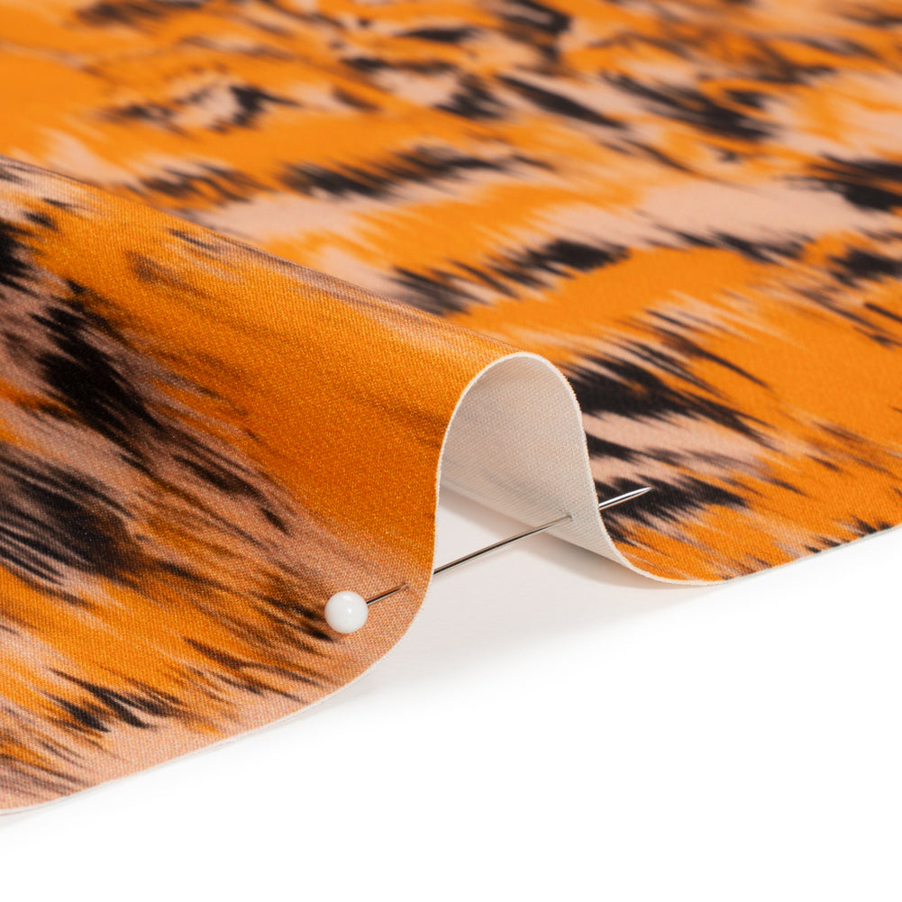 Stretch Polyester Woven Print - Orange and Black Abstract Ikat - Mood Exclusive Shifting Sands Detail Stretch Polyester Woven Print - Orange and Black Abstract Ikat - Mood Exclusive Shifting Sands Detail