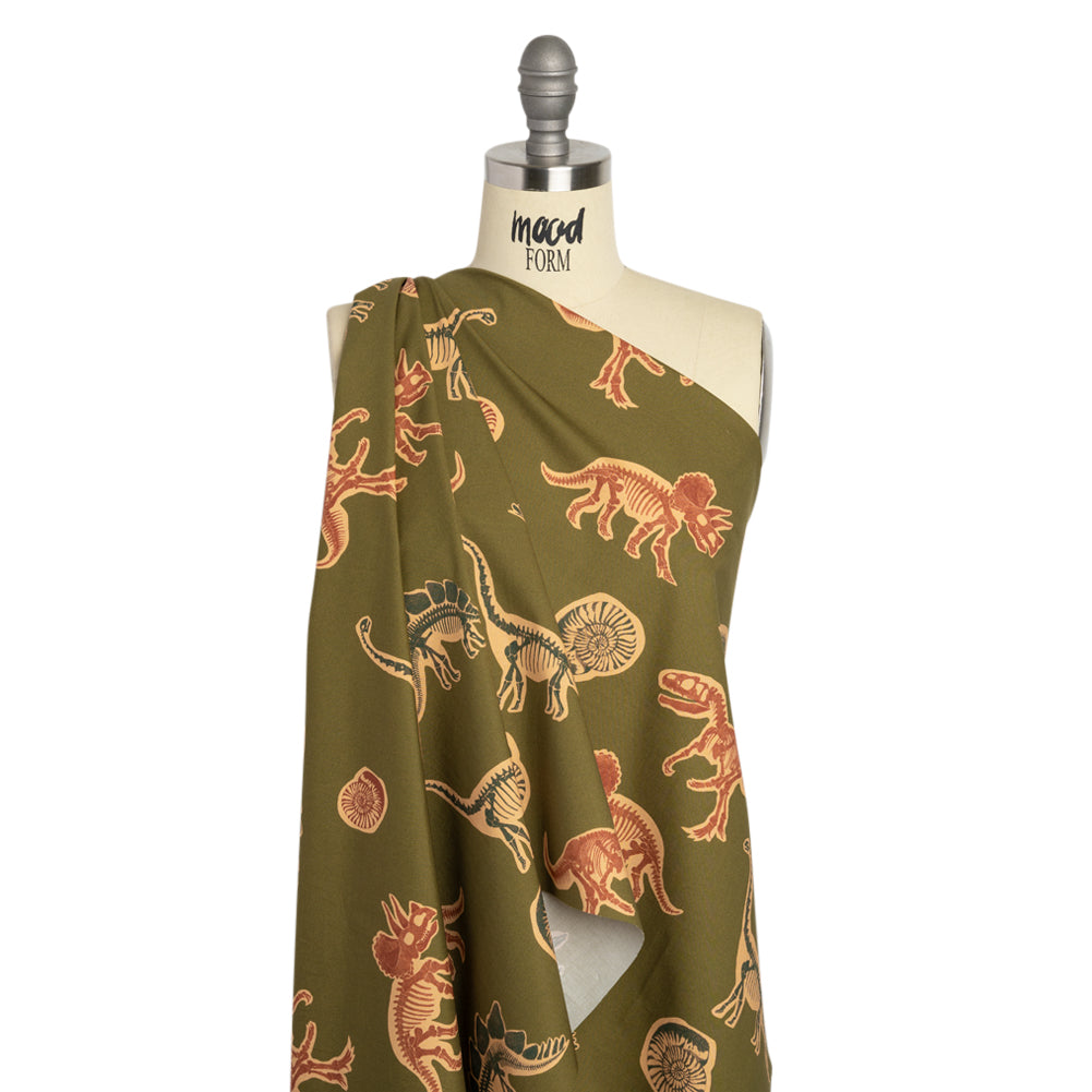 Stretch Cotton Poplin Print - Olive, Navy and Rust Dinosaur Bones and Fossils - Mood Exclusive Discovery Dig Drape Stretch Cotton Poplin Print - Olive, Navy and Rust Dinosaur Bones and Fossils - Mood Exclusive Discovery Dig Drape