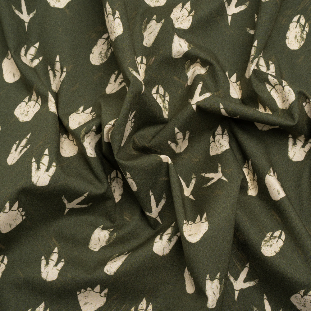 Stretch Cotton Poplin Print - Dark Olive Dinosaur Footprints - Mood Exclusive Jurassic Jubilee Stretch Cotton Poplin Print - Dark Olive Dinosaur Footprints - Mood Exclusive Jurassic Jubilee