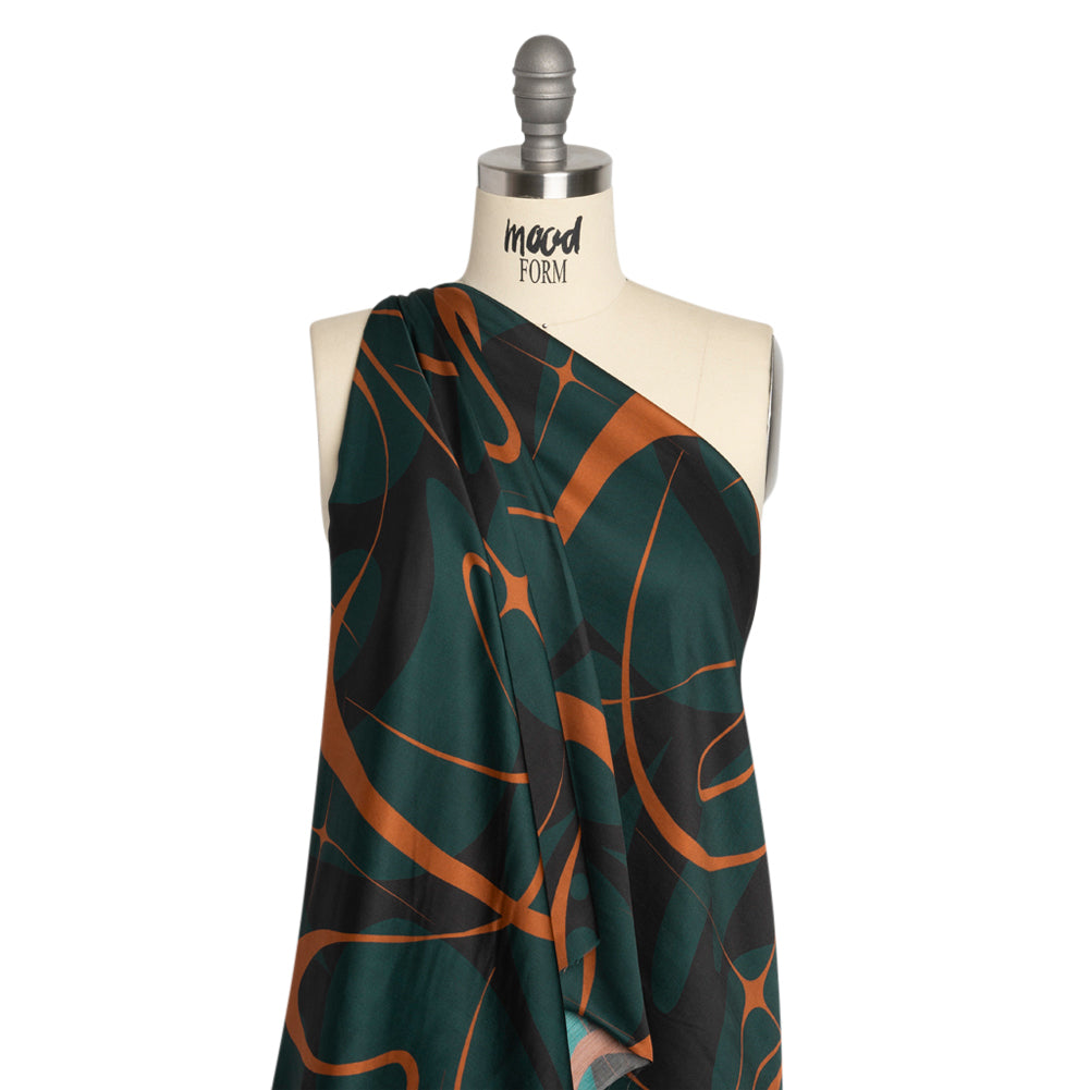 Sustainable and Recycled Viscose Satin Print - Forest Green and Orange Swirling Abstract - Mood Exclusive Atmospheric Adventure Detail Sustainable and Recycled Viscose Satin Print - Forest Green and Orange Swirling Abstract - Mood Exclusive Atmospheric Adventure Detail