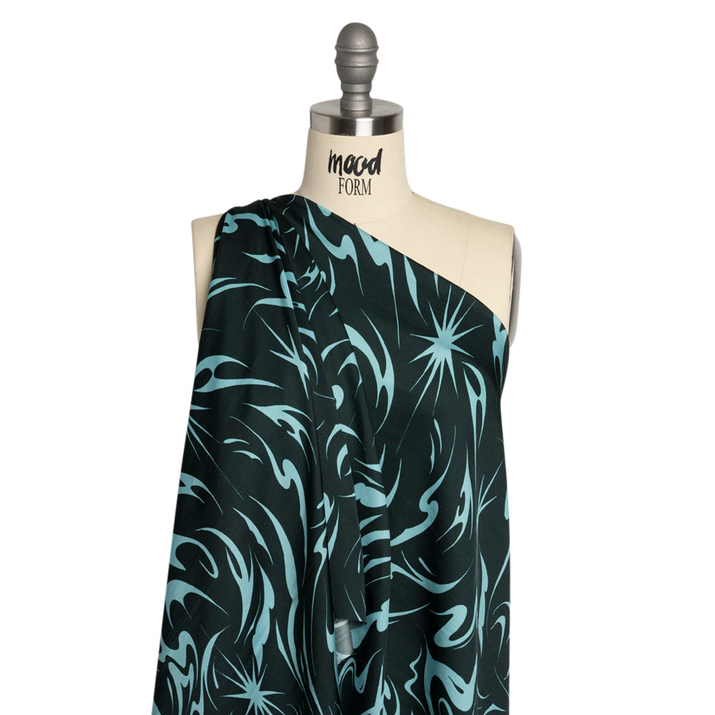 Sustainable and Recycled Viscose Satin Print - Sky Blue and Navy Swirls and Stars - Mood Exclusive Vincent's Hope Detail Sustainable and Recycled Viscose Satin Print - Sky Blue and Navy Swirls and Stars - Mood Exclusive Vincent's Hope Detail