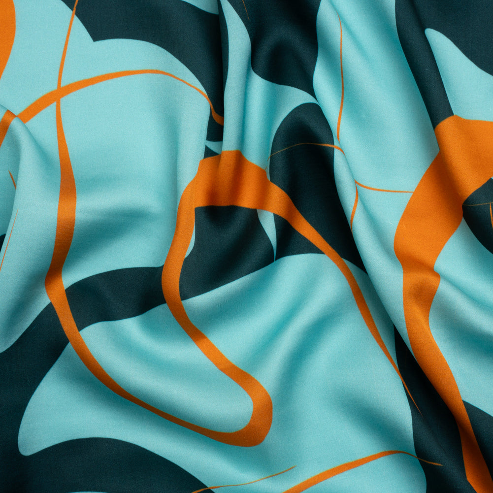 Sustainable and Recycled Viscose Satin Print - Turquoise and Orange Swirling Abstract - Mood Exclusive Atmospheric Adventure Sustainable and Recycled Viscose Satin Print - Turquoise and Orange Swirling Abstract - Mood Exclusive Atmospheric Adventure