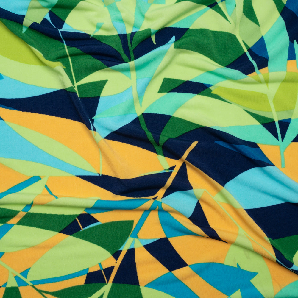 Stretch Polyester Tricot - Green, Blue and Goldenrod Overlapping Palm Leaves - Designer Deadstock Stretch Polyester Tricot - Green, Blue and Goldenrod Overlapping Palm Leaves - Designer Deadstock