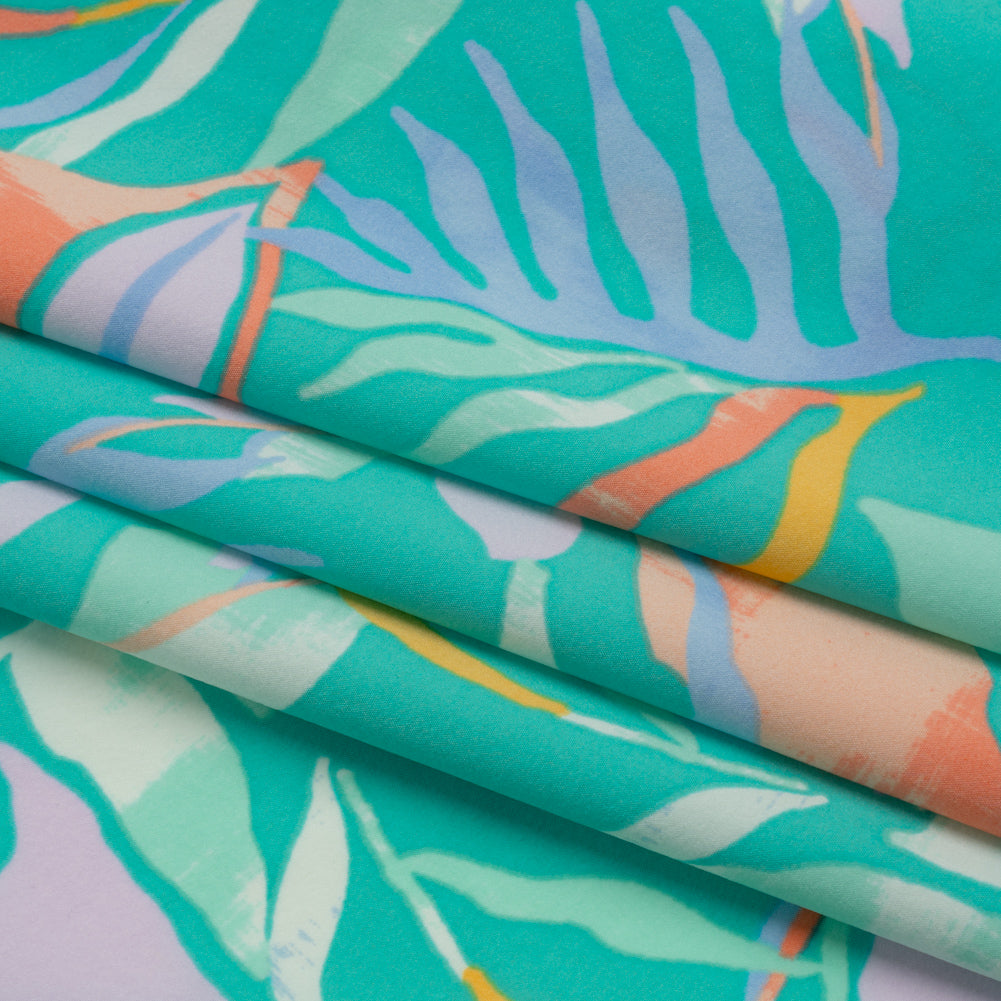 Stretch Nylon Crepe Print - Bright Teal, Periwinkle and Orange Tropical Leaves - Deadstock - Folded Stretch Nylon Crepe Print - Bright Teal, Periwinkle and Orange Tropical Leaves - Deadstock - Folded