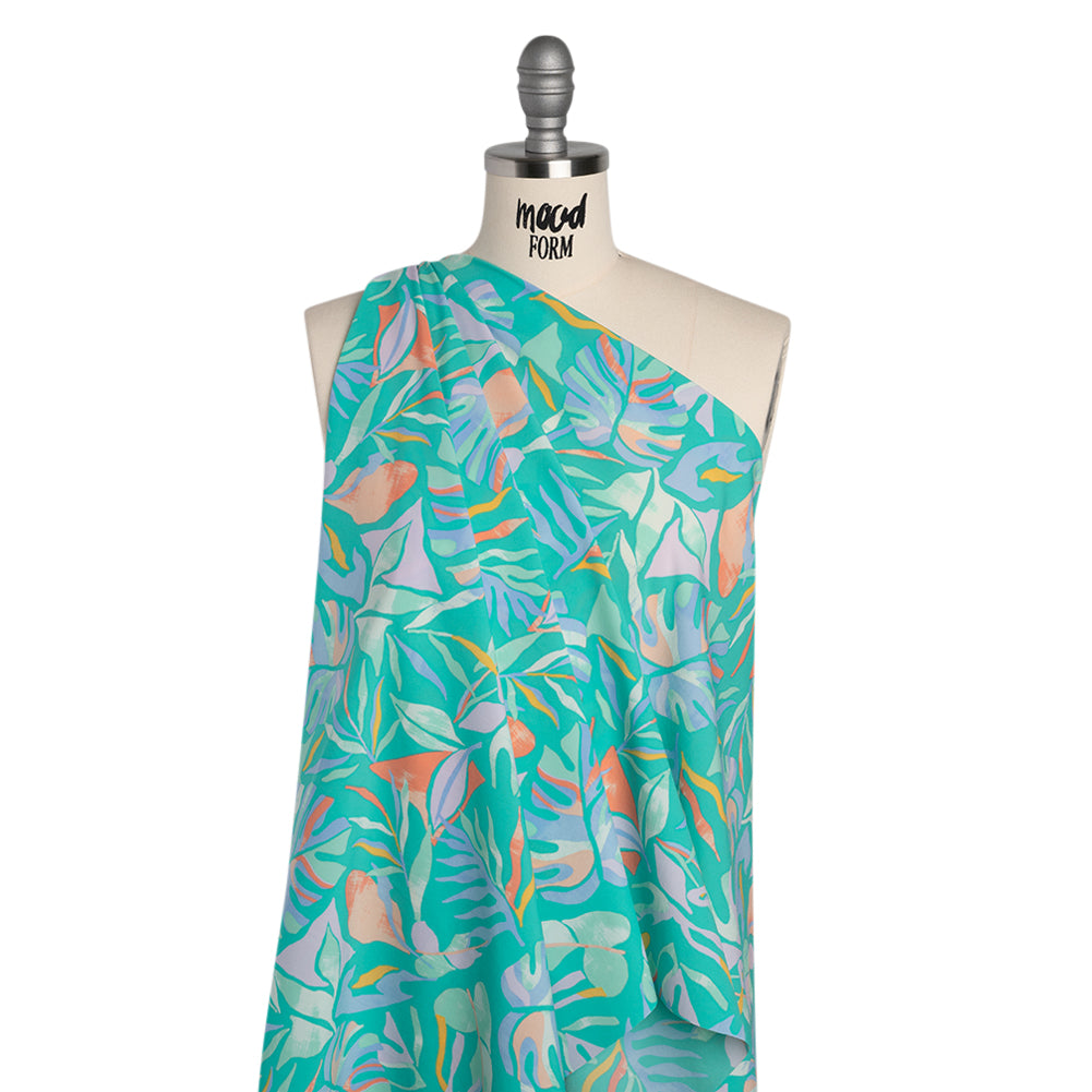 Stretch Nylon Crepe Print - Bright Teal, Periwinkle and Orange Tropical Leaves - Deadstock - Drape Stretch Nylon Crepe Print - Bright Teal, Periwinkle and Orange Tropical Leaves - Deadstock - Drape