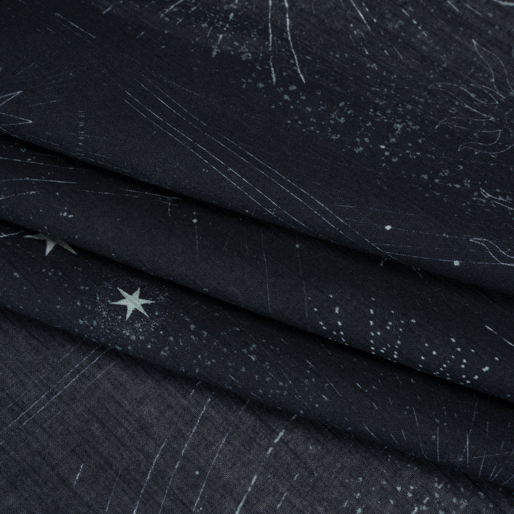 Crinkled Cotton Gauzy Woven - Midnight Blue and White Celestial Motifs - Mood Exclusive Moonlit Tides Print - Folded Crinkled Cotton Gauzy Woven - Midnight Blue and White Celestial Motifs - Mood Exclusive Moonlit Tides Print - Folded