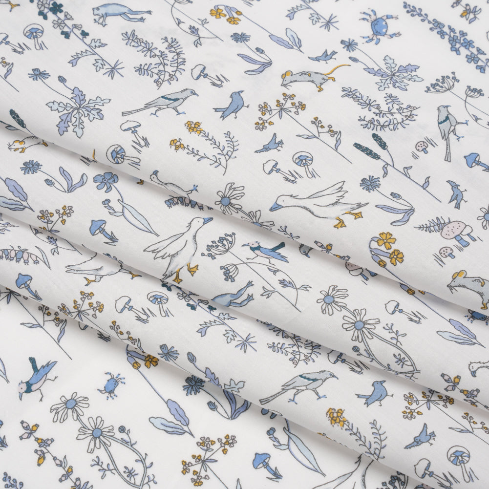 Liberty Fabrics Tana Lawn® - Theo Blue - Baby Blue, Yellow and White Cartoon Creatures and Flowers Liberty Fabrics Tana Lawn® - Theo Blue - Baby Blue, Yellow and White Cartoon Creatures and Flowers