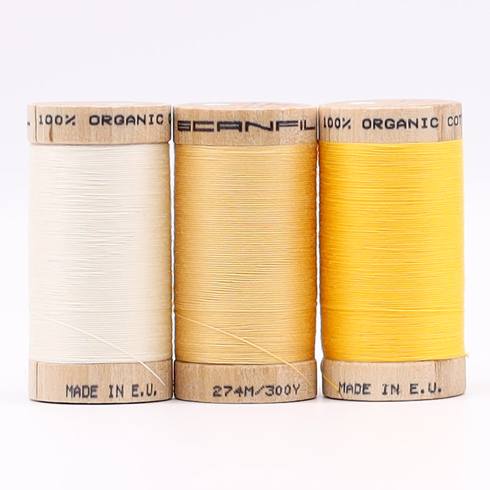 SCANFIL® 30wt Organic Pima Cotton Thread Trio Set - 3ct 300yd Spools - Sunshine Yellows Folded SCANFIL® 30wt Organic Pima Cotton Thread Trio Set - 3ct 300yd Spools - Sunshine Yellows Folded