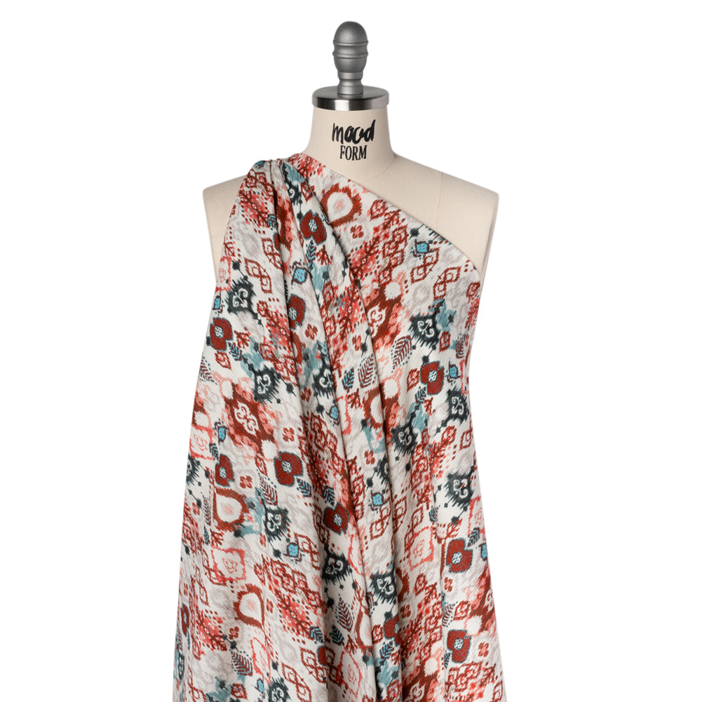 Slubbed Gauzy Cotton Woven - Coral Red, Dark Blue and Light Gray Ikat Leaves and Swirls - Mood Exclusive Fanciful Fairy Print Slubbed Gauzy Cotton Woven - Coral Red, Dark Blue and Light Gray Ikat Leaves and Swirls - Mood Exclusive Fanciful Fairy Print