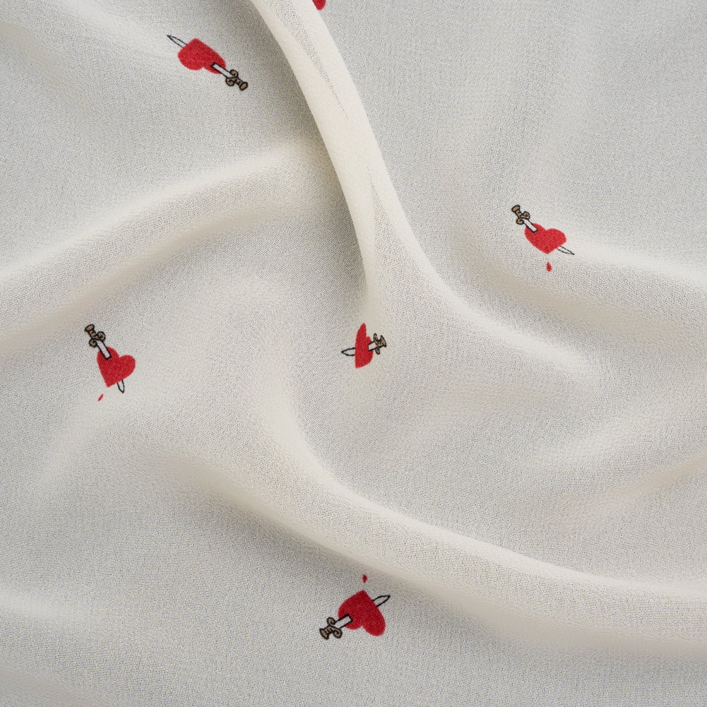 Viscose Georgette Print - Lipstick Red and Cream Dagger in Heart Graphic - Designer Deadstock Viscose Georgette Print - Lipstick Red and Cream Dagger in Heart Graphic - Designer Deadstock