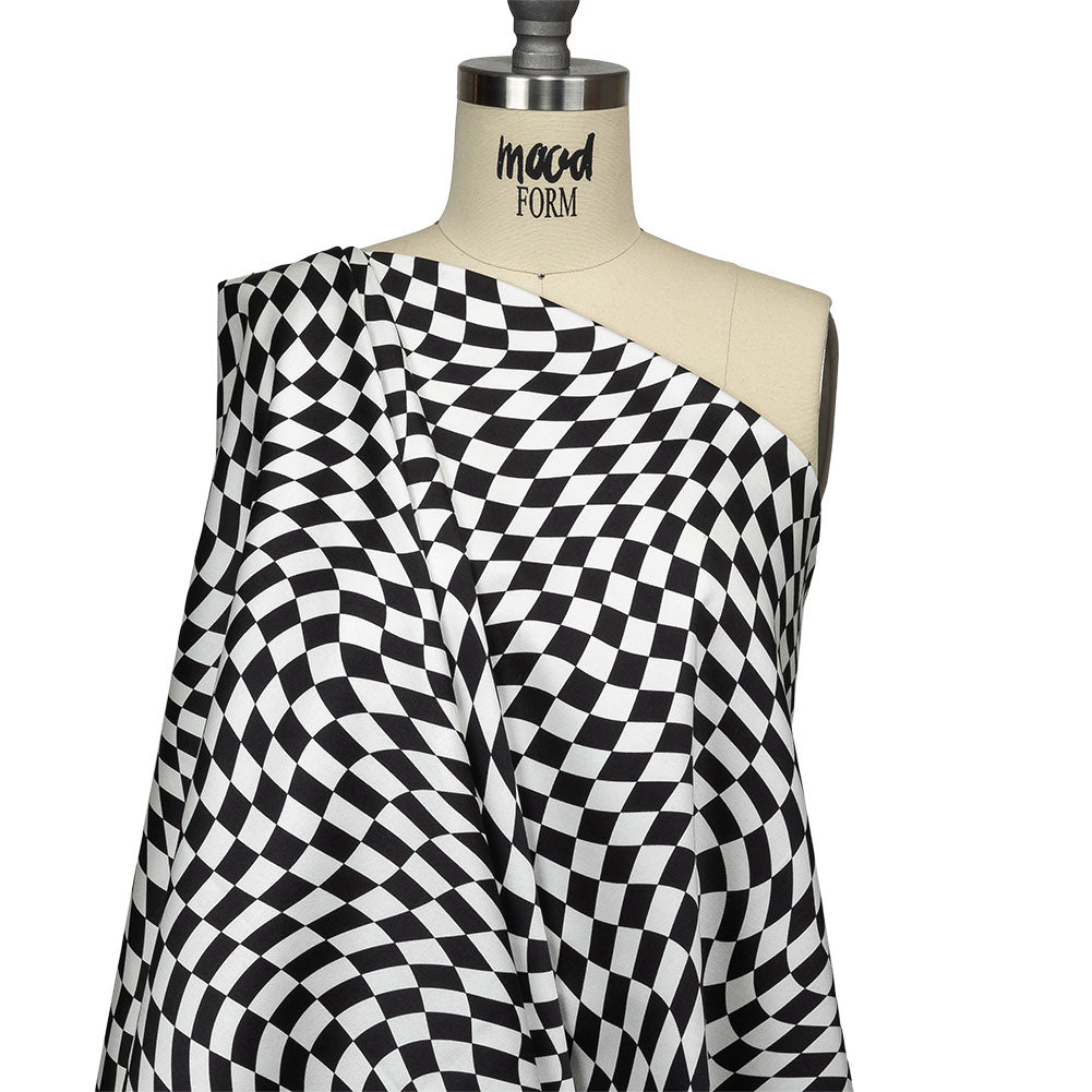 Stretch Cotton Sateen - Black and White Warped Checks - Down the Rabbit Hole Print - Mood Exclusive Indigo Collection Stretch Cotton Sateen - Black and White Warped Checks - Down the Rabbit Hole Print - Mood Exclusive Indigo Collection