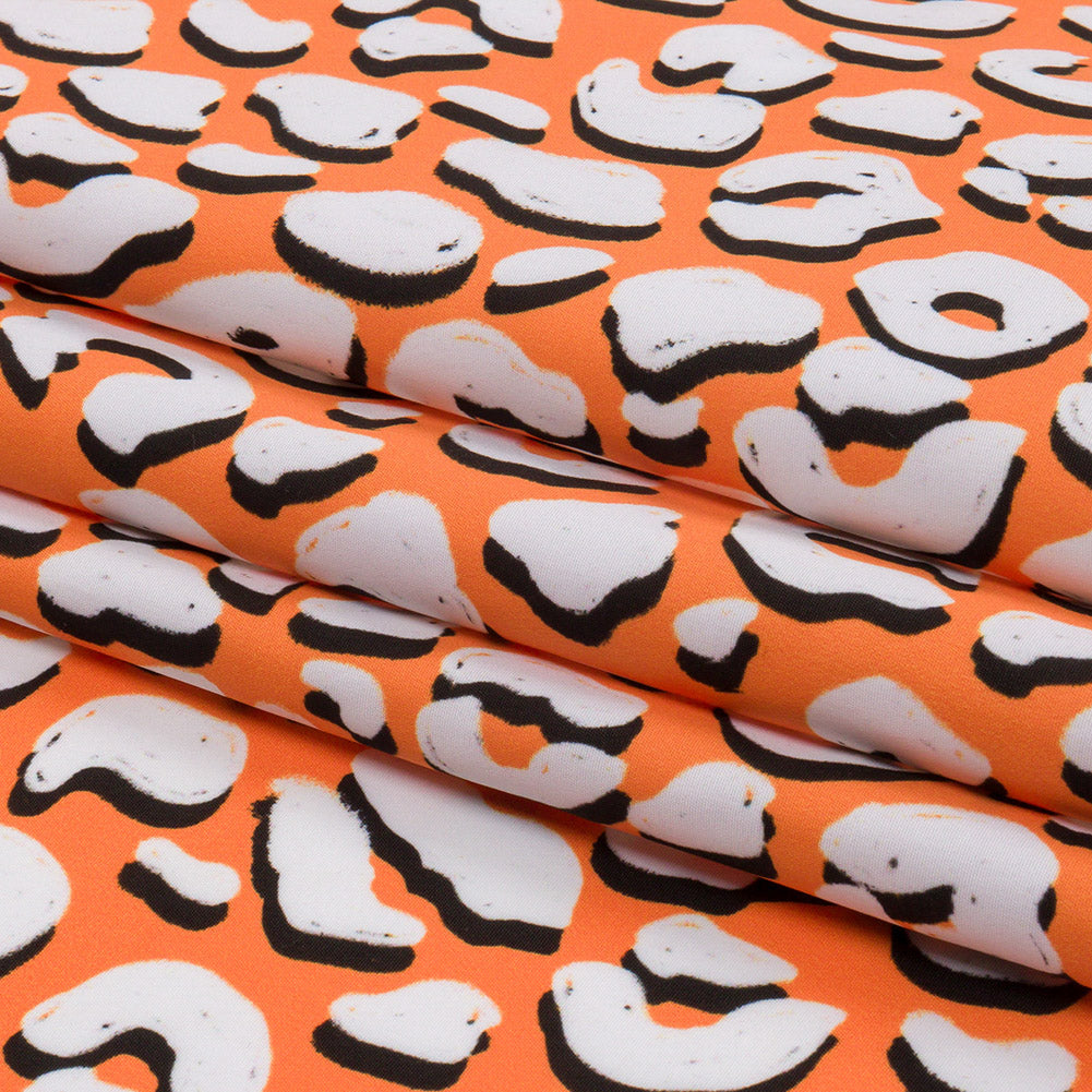 Recycled Polyester Swim Trunk Fabric - Orange and White Animal Spots - Dune Surfing Print - Mood Exclusive Malibu Collection - Folded Recycled Polyester Swim Trunk Fabric - Orange and White Animal Spots - Dune Surfing Print - Mood Exclusive Malibu Collection - Folded