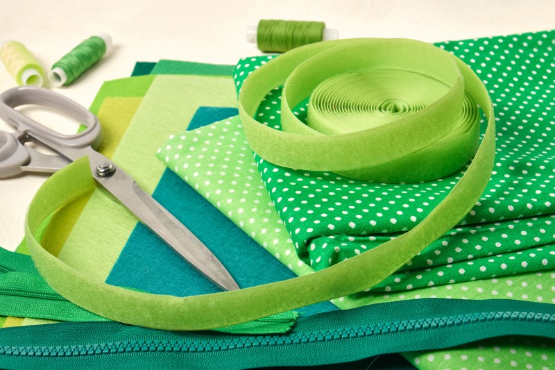 Green fabric, velcro, and zipper