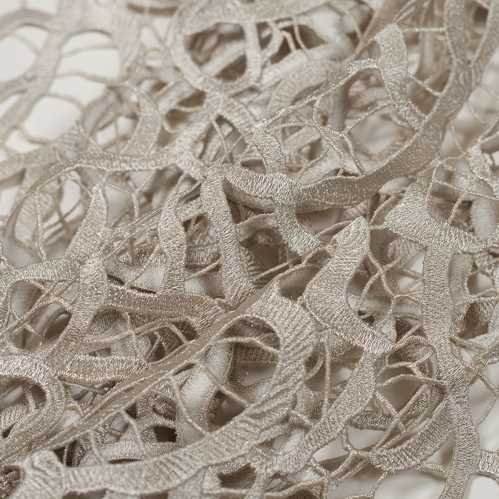 Metallic Silver Abstract Guipure Lace Fabric - Folded