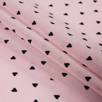 Black Hearts Printed on a Pink Crinkled Chiffon Folded