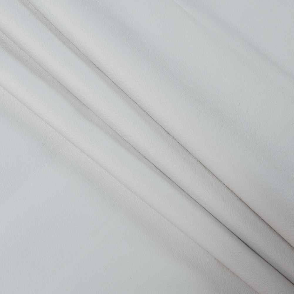 Italian White Faux Leather with White Knit Backing Folded