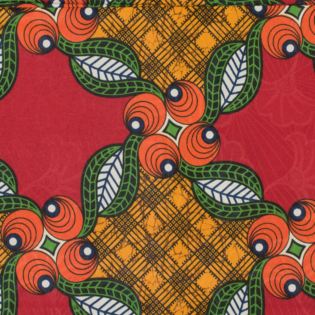 Red, Orange and Green Waxed Cotton African Print with additional Inlaid Pattern Folded