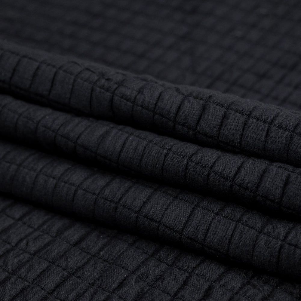 Black Quilted Rayon Knit with Filler and Polyester Knit Backing Folded