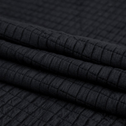 Black Quilted Rayon Knit with Filler and Polyester Knit Backing Folded