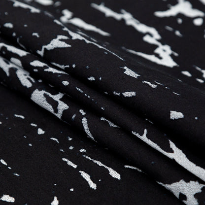 Black and White Abstract Burnout Polyester Woven with Fused Backing Folded