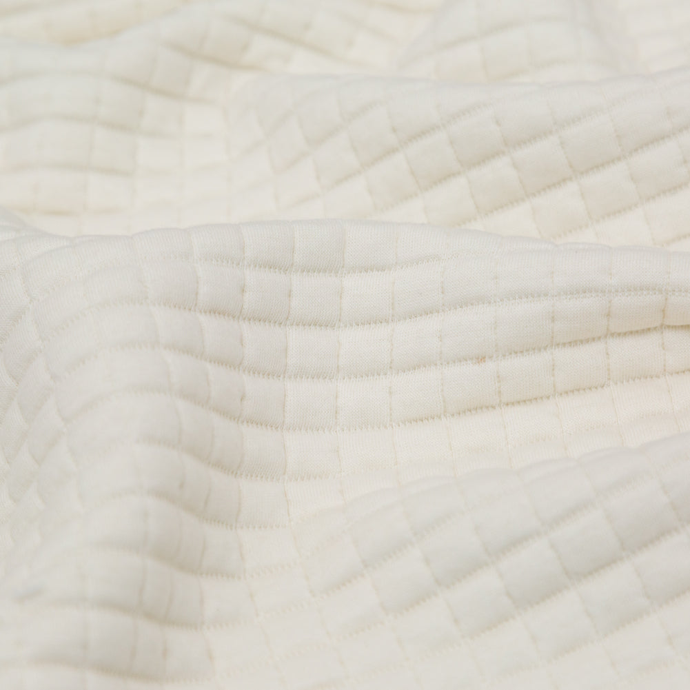 Italian Cream Quilted Rayon Knit with Filler and Polyester Knit Backing Detail