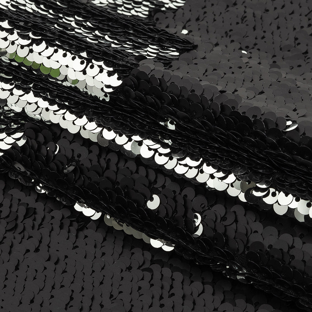 Matte Black and Reflective Silver Two-Tone Reversible Sequins on Black Polyester Jersey Folded