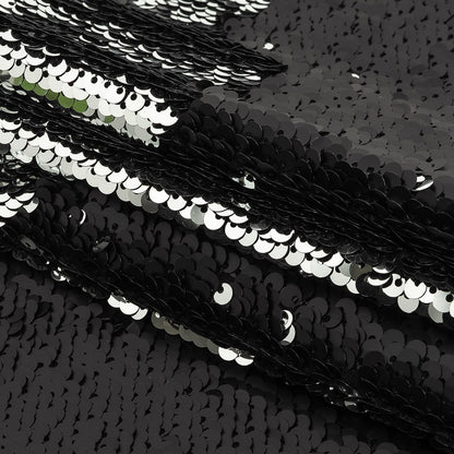 Matte Black and Reflective Silver Two-Tone Reversible Sequins on Black Polyester Jersey Folded