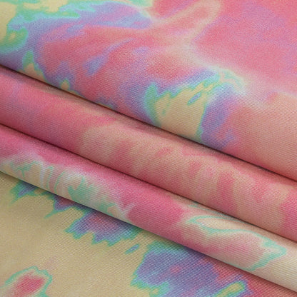 Traje de baño de compresión de tricot, con protección UV y microcápsulas de aloe vera - Estampado tie-dye en suaves remolinos amarillos, rosas y naranjas - Colección Caye