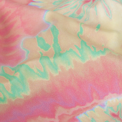 Traje de baño de compresión de tricot, con protección UV y microcápsulas de aloe vera - Estampado tie-dye en suaves remolinos amarillos, rosas y naranjas - Colección Caye