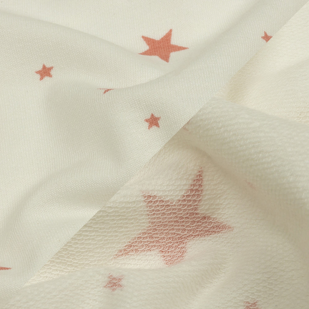 Cloud Dancer and Coral Almond Stars Stretch Polyester and Rayon French Terry Detail