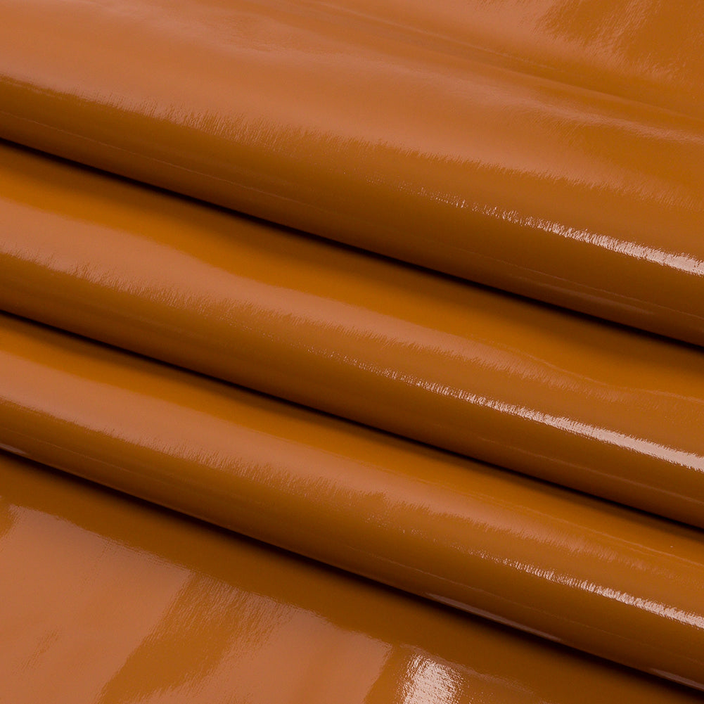 Tan Stretch Faux Patent Leather with White Viscose Jersey Backing Folded