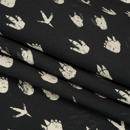 Stretch Cotton Poplin Print - Black Dinosaur Footprints - Mood Exclusive Jurassic Jubilee Folded