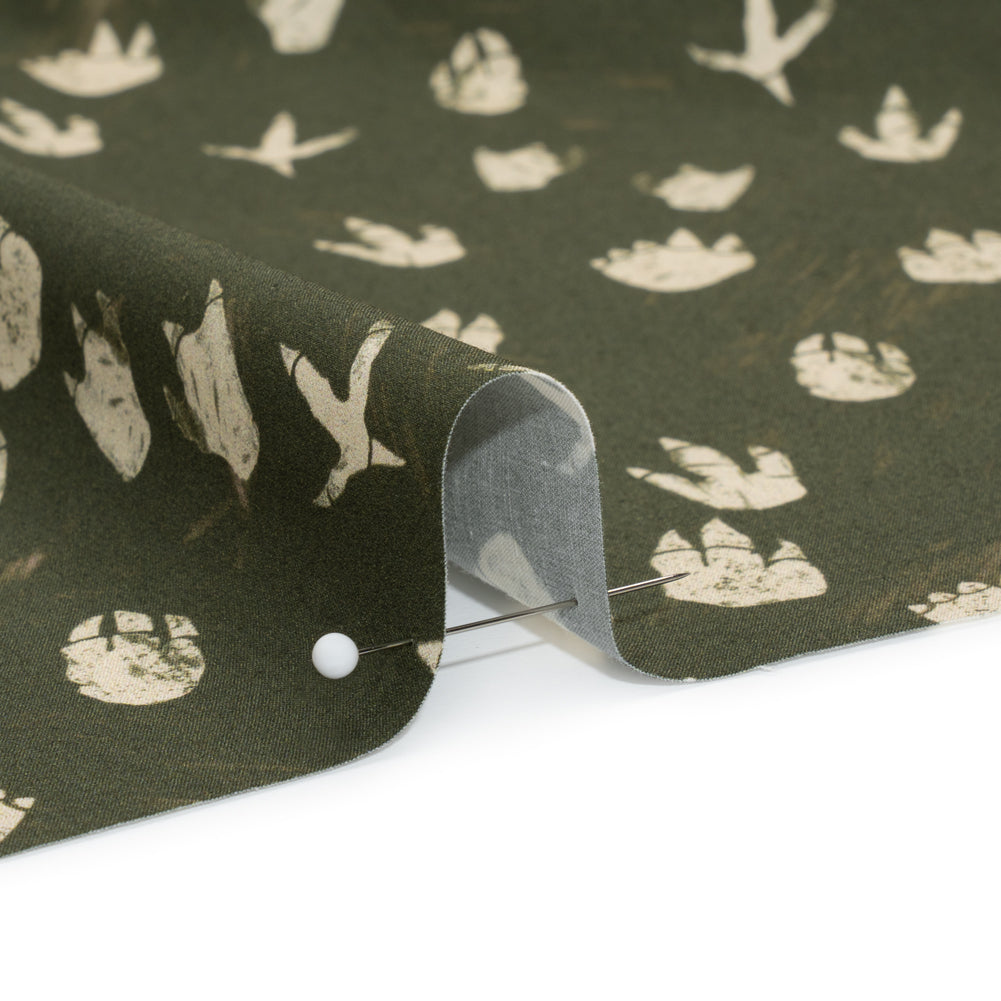 Stretch Cotton Poplin Print - Dark Olive Dinosaur Footprints - Mood Exclusive Jurassic Jubilee Detail